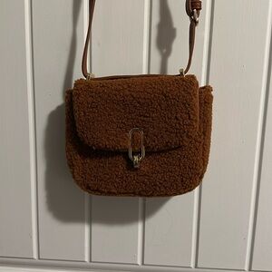 A new day sherpa crossbody purse